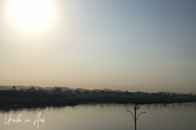 Sun over a hazy morning on the Nile, Edfu Egypt