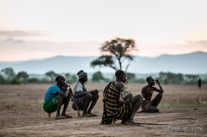 Kara men on their stools, early morning, Dus Village Ethiopia