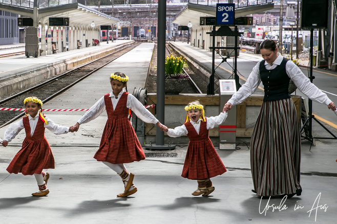 Small Norwegian girls and a female teacher in folk costume, Bergen
