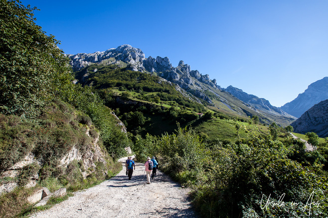 Walkers on the Vega de Sotres, Picos de Europa, Asturias Spain.