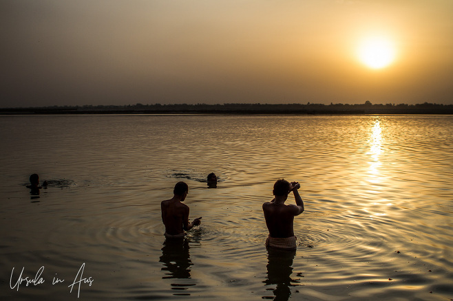 Men bathing in the Ganges at sunrise, Varanasi India