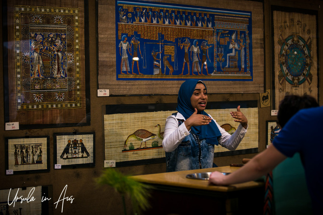 Woman in a hijab explaining papyrus, Giza Egypt