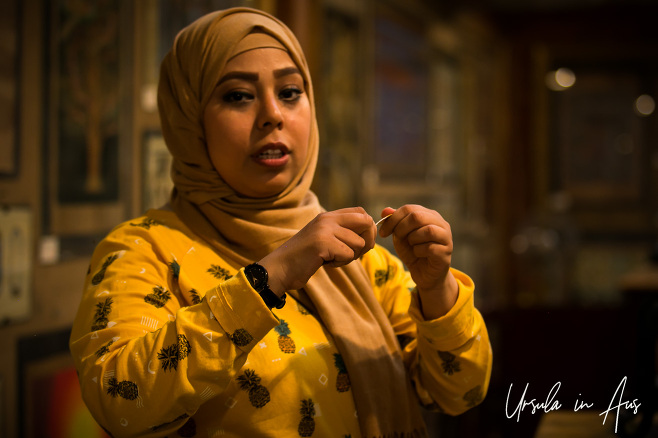 Portrait: Woman in a hijab explaining papyrus, Giza Egypt