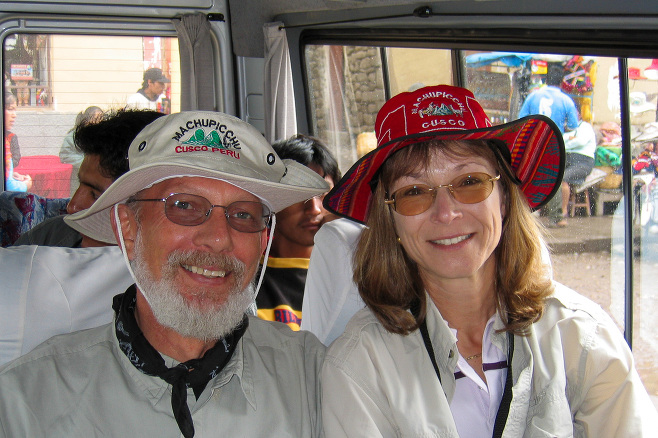 Man and woman in Machu Picchu hats, Peru