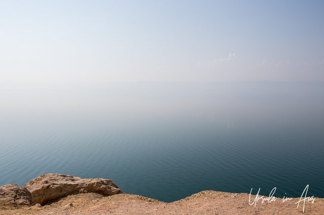 Water merging into air over a Dead Sea landscape, Jordan.