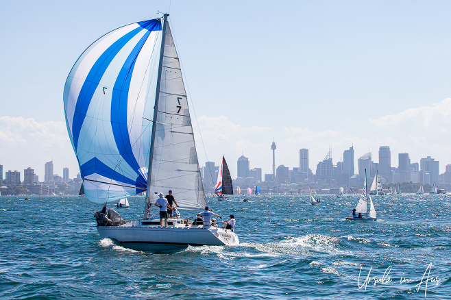 Sailboats in Sydney Harbour with the CBD in the background, Australia.