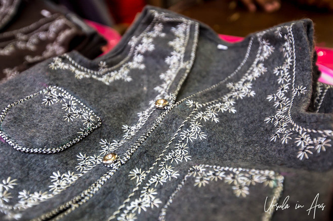 Embroidered felt vests in a shopfront, Haridwar India