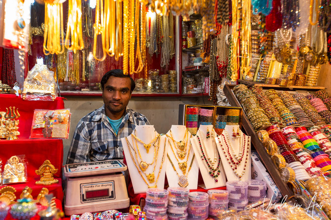 Man in a jewellery store, Haridwar, India