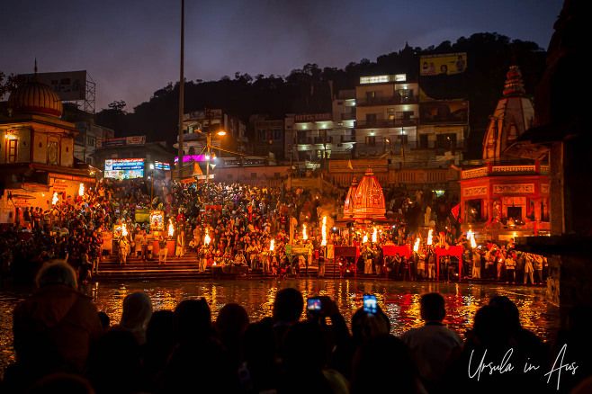 Lights, flames, Hindu priests, and lay-people crowded onto Har Ki Pauri ghat after dark, Haridwar, India