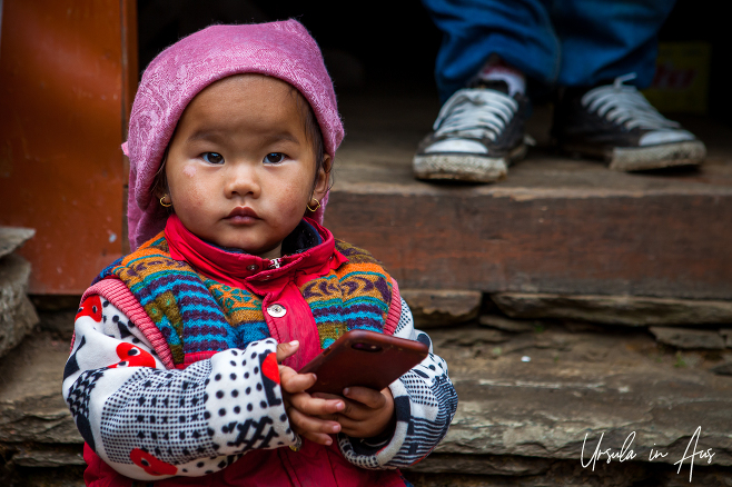 Environmental portrait: toddler with an iPhone, Bhaisikharka Nepal