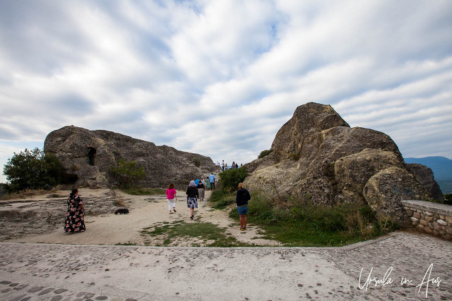 Tourists walking across the flat to the Psaropetra Lookout, Meteora, Greece