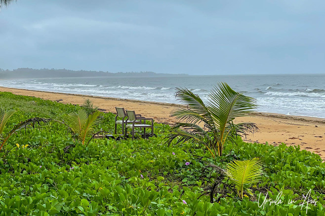 Plastic chairs on a rainy beach, Mission Beach, Queensland Australia