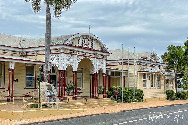 The old white and cream Emerald Railway Station from the street, Queensland. 