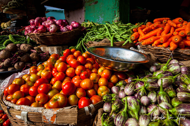 Tomatoes, aubergines, onions and carrots for sale, Usilampatti market, Tamil Nadu India