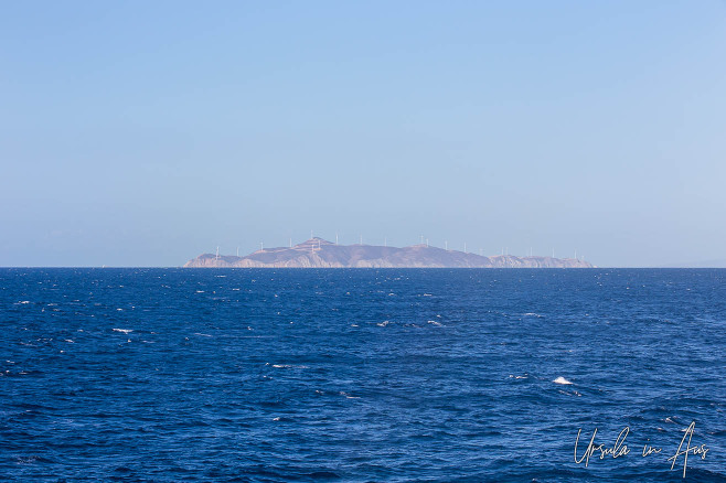 Wind Farm on Agios Georgios from a passing ferry, Greece.