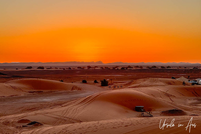 Orange skies over the dunes of the Sahara, Erg Chebb, Morocco.