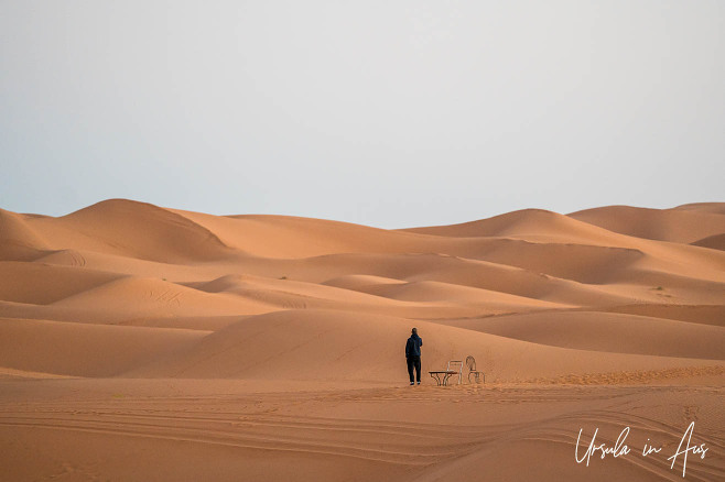 A man in the predawn dunes, Erg Chebb, Morocco. 