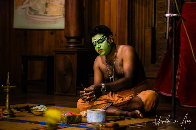 Portrait: Man painting stage makeup on his face, Great K V Kathakali Center in Fort Kochi, Kerala India