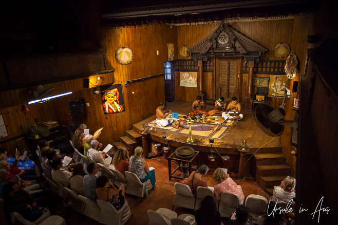 View over the stage of the Great K.V Kathakali Center, Fort Kochi India, where artists are getting into makeup.